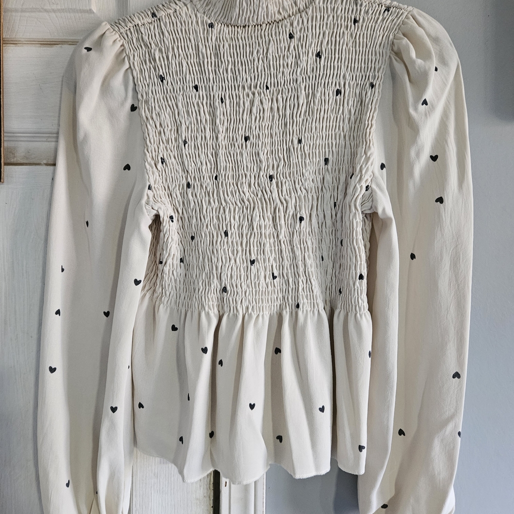 Elegant Cream Smocked Blouse with Black Heart Accents